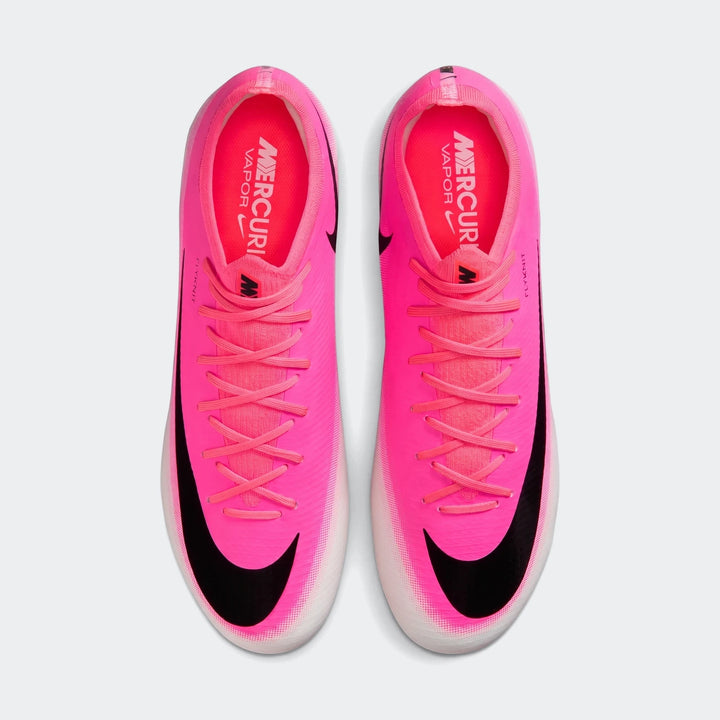Bright pink Nike Mercurial Vapor 17 Pro Firm-Ground Low-Top Soccer Cleats with black swooshes, top-down view.