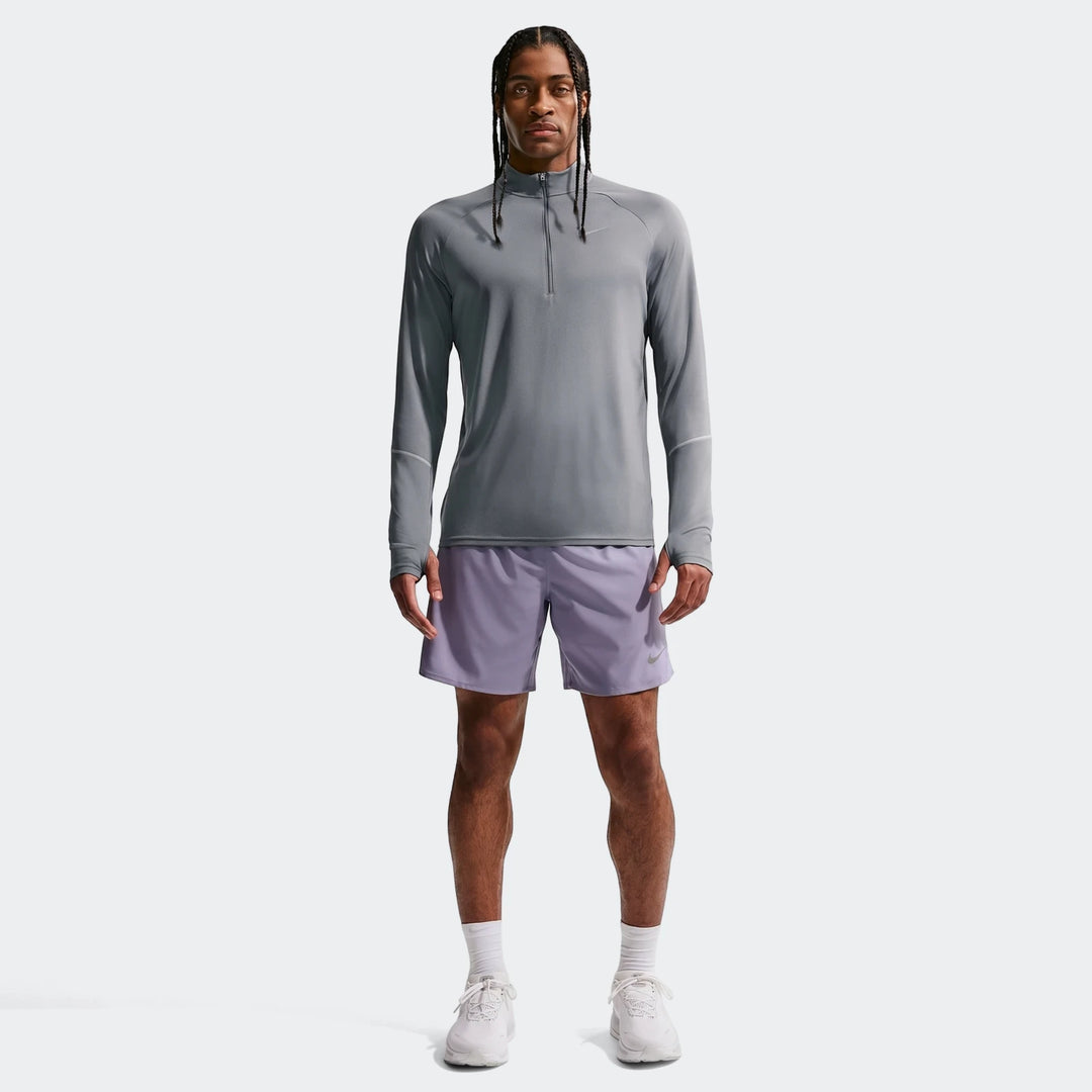 Nike Miler men's Dri-Fit 1/2-Zip Running Top in grey, paired with purple athletic shorts and white shoes, modeled full