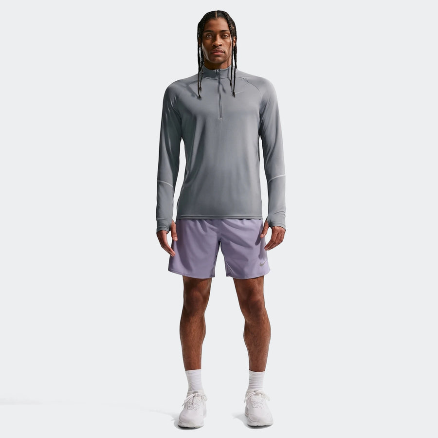 Nike Miler men's Dri-Fit 1/2-Zip Running Top in grey, paired with purple athletic shorts and white shoes, modeled full