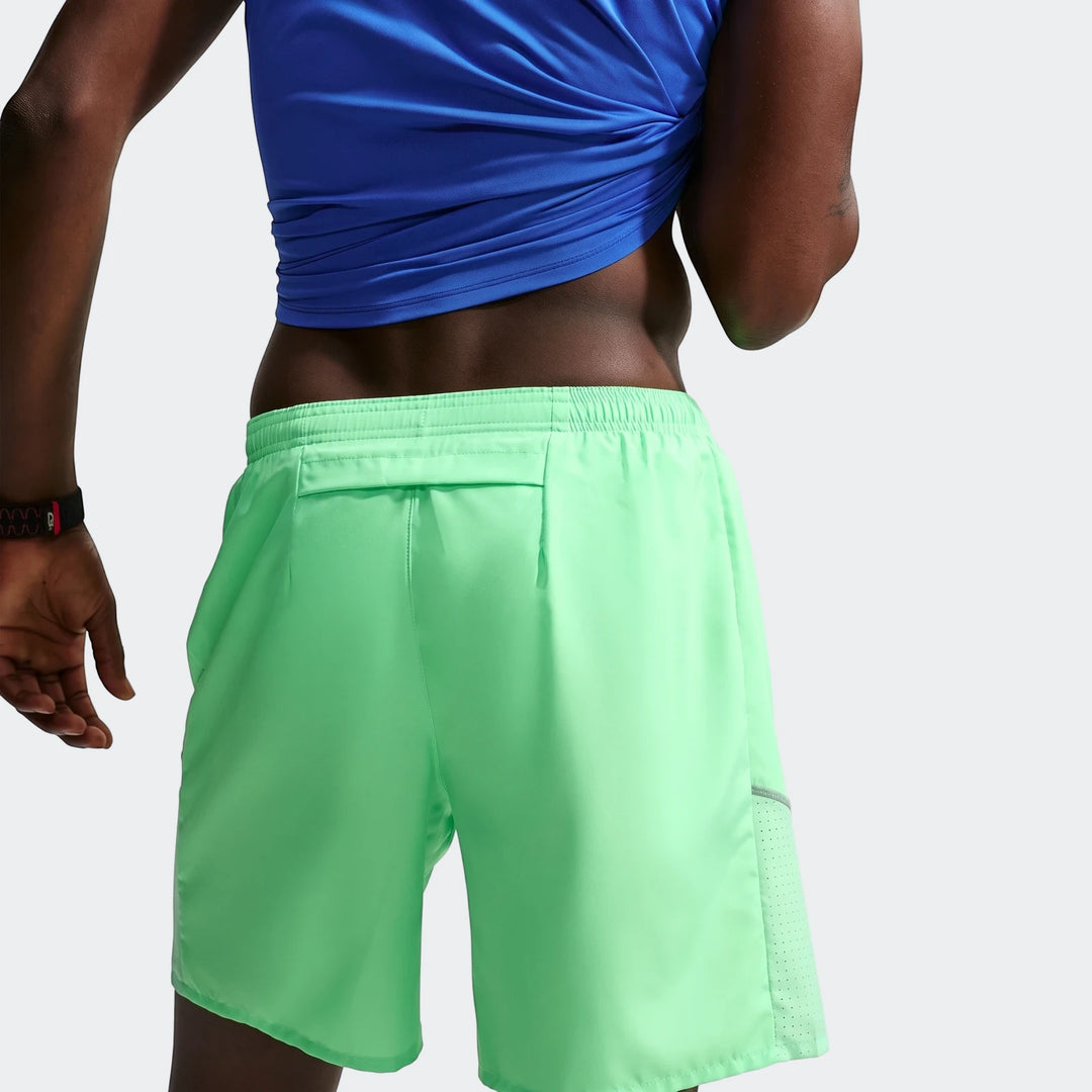 Neon green Nike Miler Men's Dri-Fit 7" brief-lined running shorts shown from the back on a model.