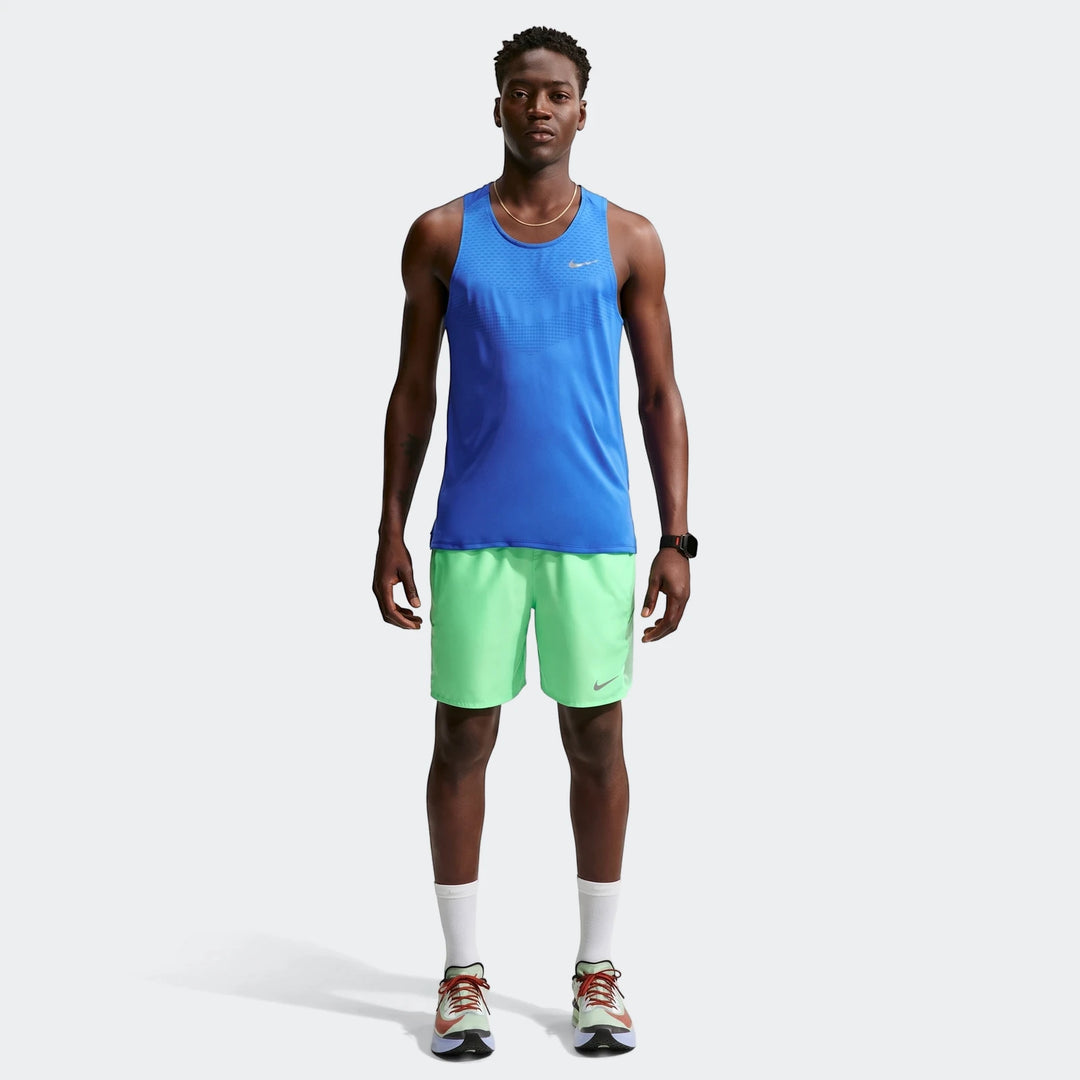 Nike Miler Men's Dri-Fit 7" Brief-Lined Running Shorts in lime green, worn by a male model with a blue tank top, full body