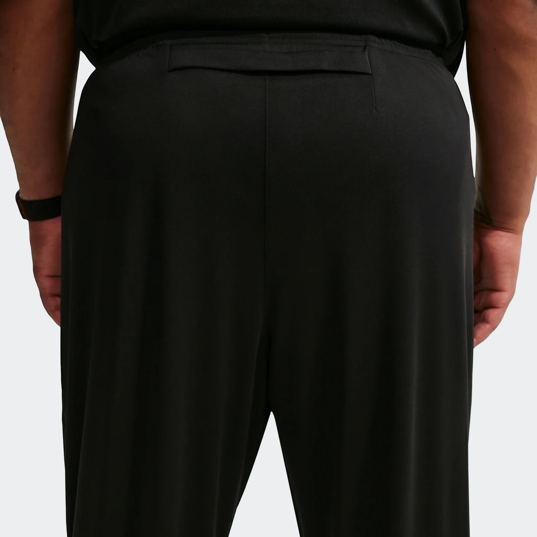 Men's Nike Miler Dri-Fit knit running pants in black, shown from the back, highlighting the fabric texture and waistband.