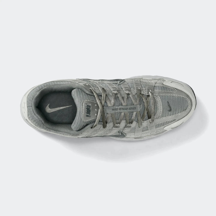 Nike P-6000 men's shoes in gray and silver, featuring a mesh upper and synthetic overlays, viewed from above.