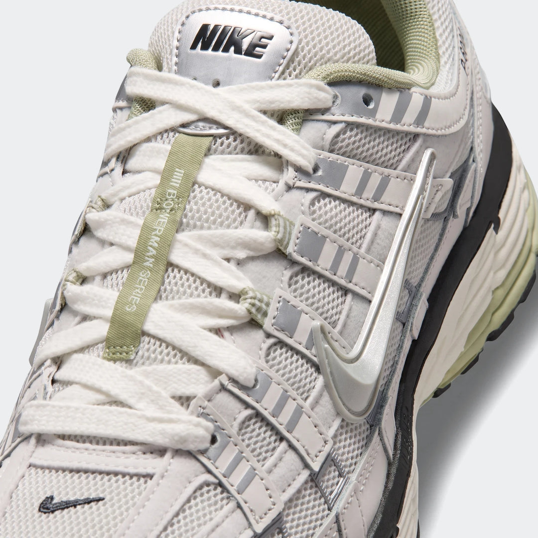 Nike P-6000 Men’s Shoes in light gray mesh with white laces and olive-green accents, front view highlighting the athletic