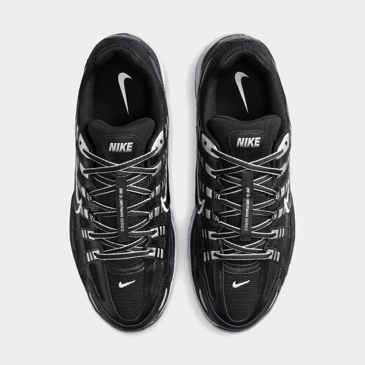 Top-down view of black Nike P-6000 shoes with white laces and silver accents, ideal for running and casual wear.