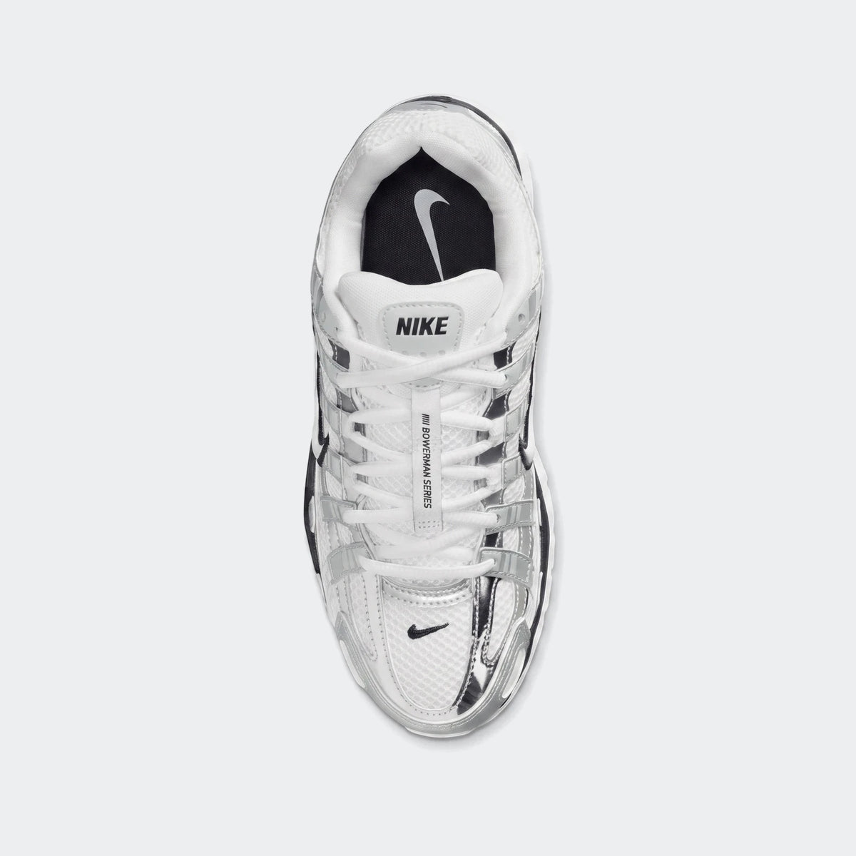 Top-down view of white and silver Nike P-6000 Women's athletic shoes with mesh and metallic overlays.