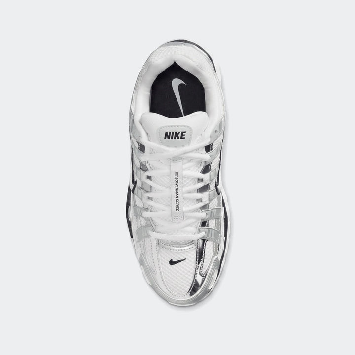 Top-down view of white and silver Nike P-6000 Women's athletic shoes with mesh and metallic overlays.