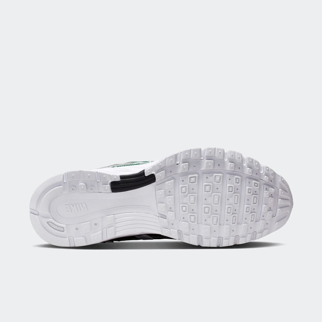 Nike P-6000 women's shoe, bottom view, showing the white sole with intricate geometric tread pattern and branding.
