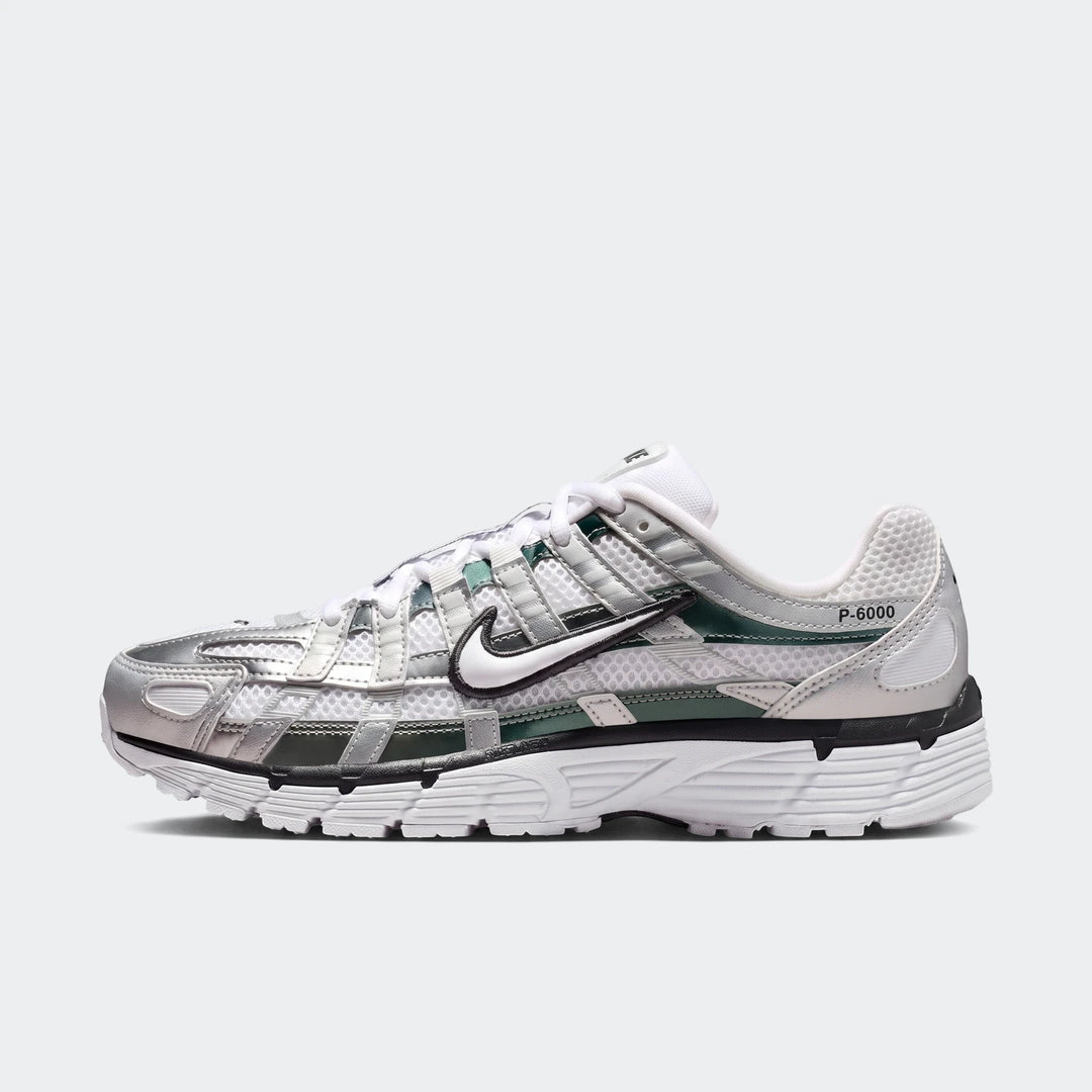 Nike P-6000 Women's Shoes in silver, white, and dark green, viewed from the side on a plain white background.