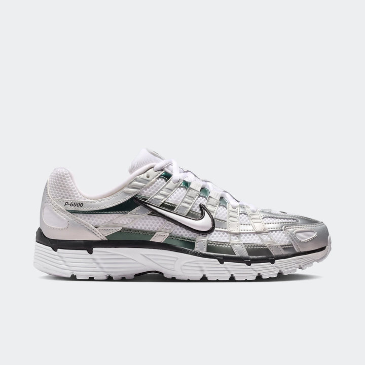 Nike P-6000 Women's Shoes in white, silver, and dark green mesh with metallic overlays, visible from a side angle.