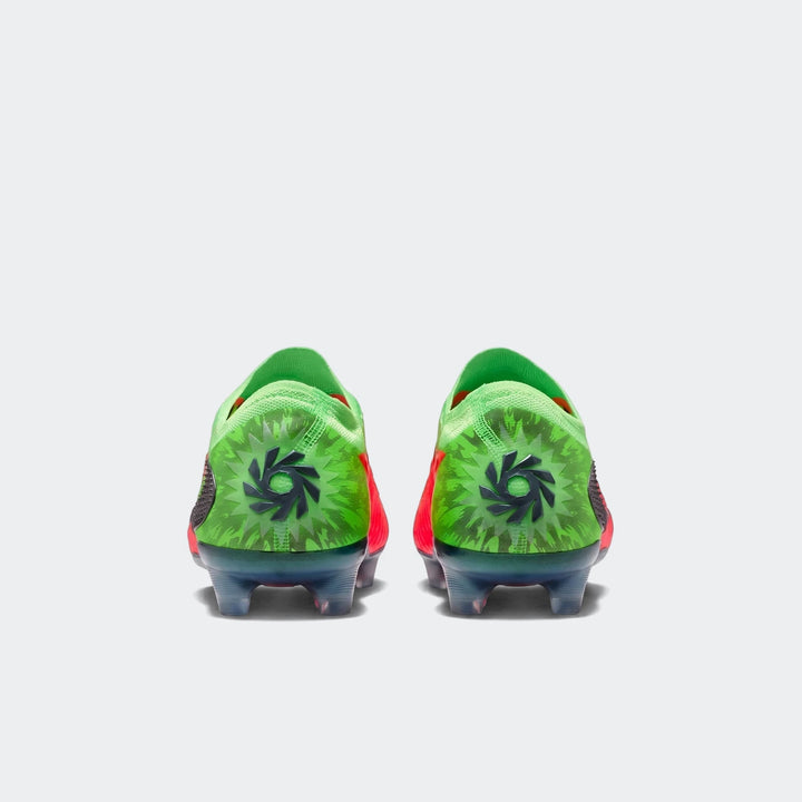 Pair of Nike Phantom 6 Low Elite Erling Haaland firm-ground soccer cleats in vibrant green, red, black, and blue, seen from