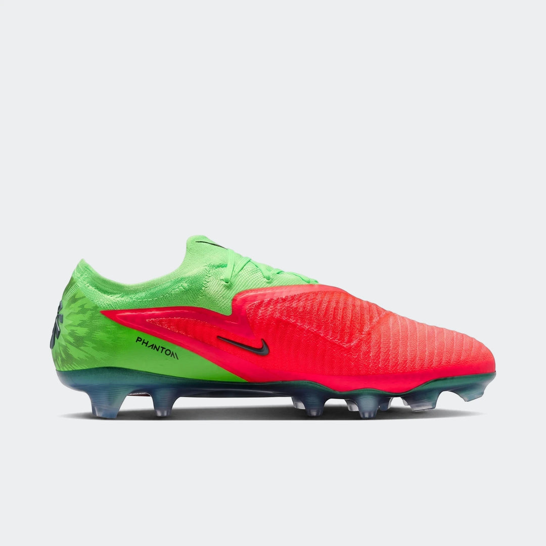 Nike Phantom 6 Low Elite Erling Haaland firm-ground soccer cleats in vibrant red and green, shown in a profile view.