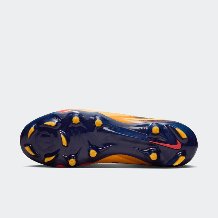 Sole view of a Nike Phantom 6 Low Pro FG soccer cleat in vibrant orange with a dark blue soleplate and yellow studs.