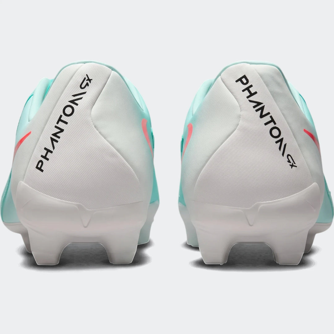 Rear view of two Nike Phantom Gx 11 Academy Fg/Mg green soccer cleats with white heels and coral accents.