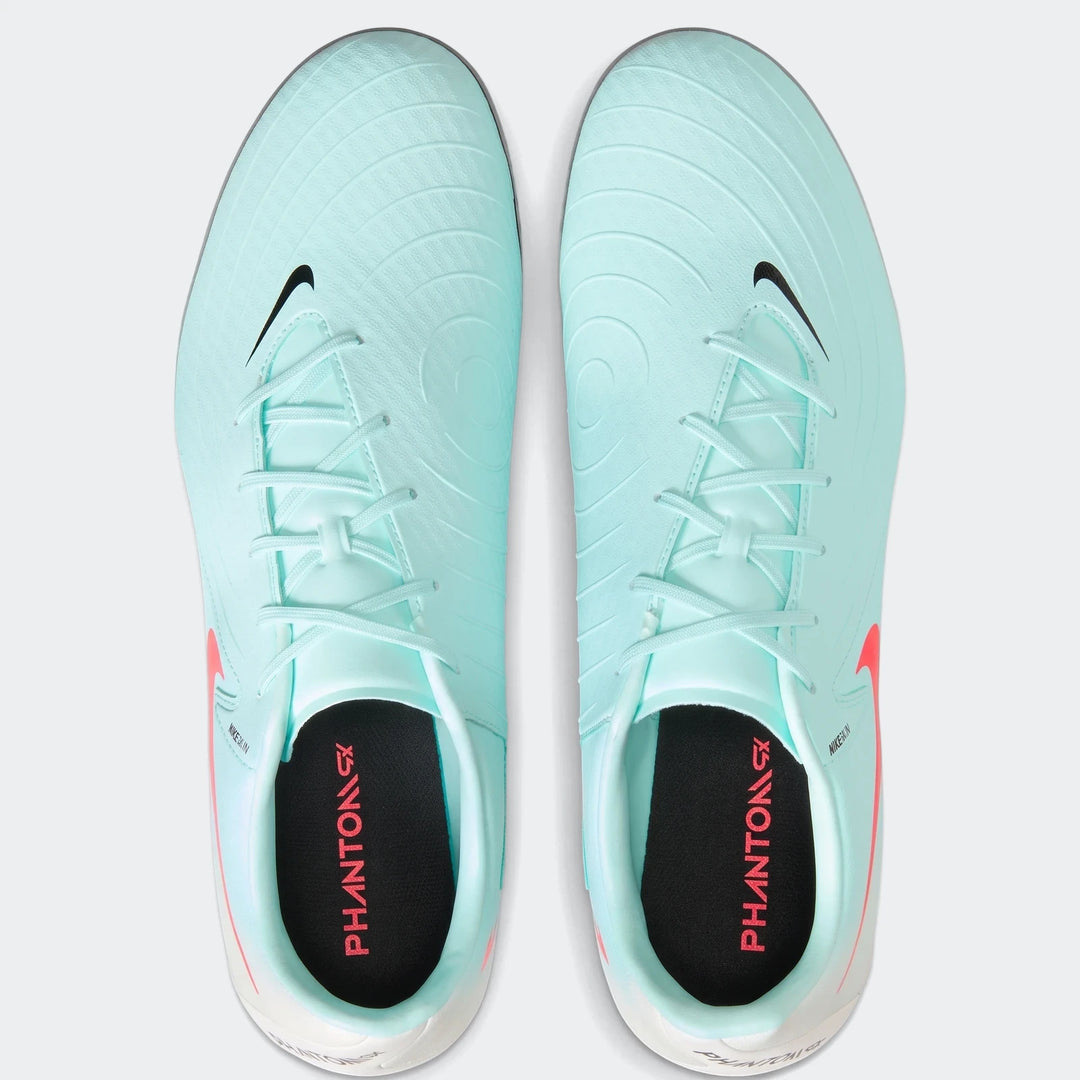 Top-down view of a pair of mint green Nike Phantom Gx 11 Academy Fg/Mg soccer cleats with black swoosh logos.