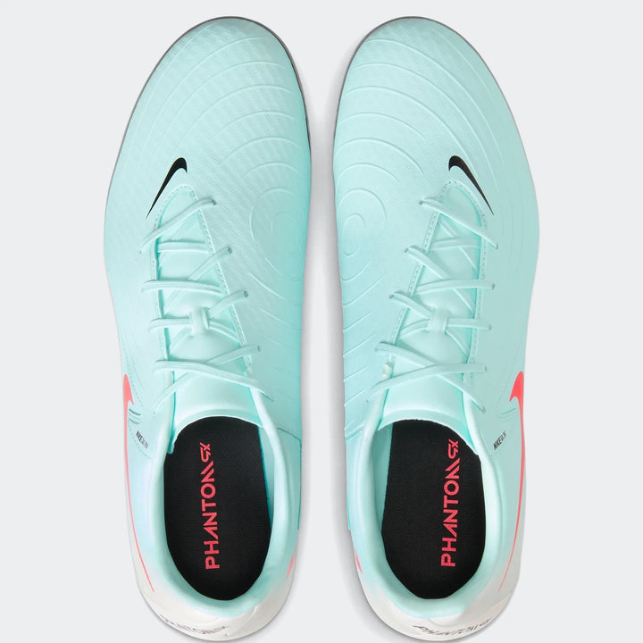 Top-down view of a pair of mint green Nike Phantom Gx 11 Academy Fg/Mg soccer cleats with black swoosh logos.