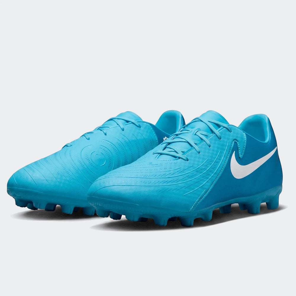 A pair of bright blue Nike Phantom Gx 11 Club Fg/Mg soccer boots, featuring a white swoosh and textured upper, displayed
