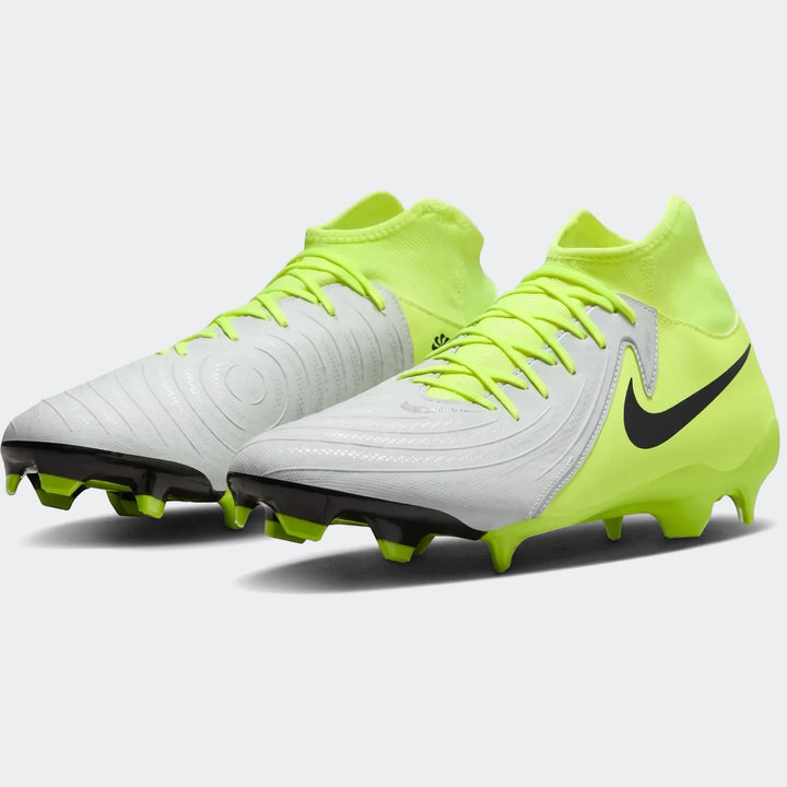 Pair of Nike Phantom Luna 11 Academy Fg/Mg soccer cleats in white and neon green, angled view.