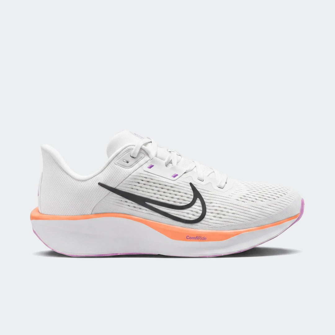Nike Quest 6 white running sneakers, featuring a black swoosh, orange midsole, and purple accents, shown in a side view.
