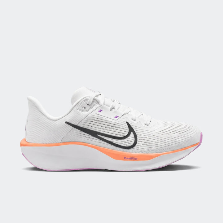Nike Quest 6 white running sneakers, featuring a black swoosh, orange midsole, and purple accents, shown in a side view.