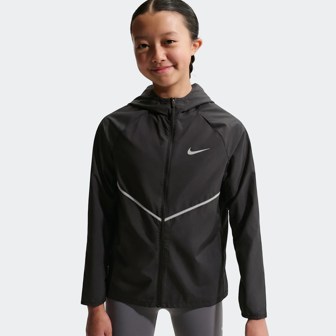 Young girl wearing a black Nike+ Repl Miler Jacket with a silver swoosh logo and reflective stripes, featuring a full zipper