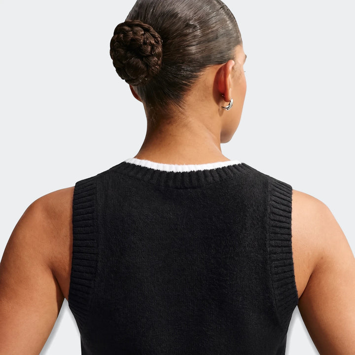 Back view of Nike Sportswear Chill Knit Women's Loose Sweater Vest in black, featuring a white collar and ribbed armholes.