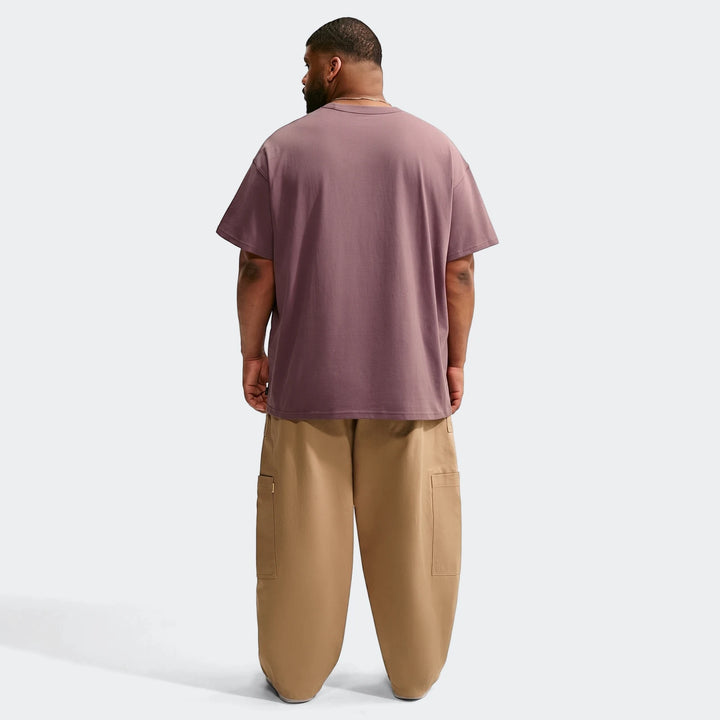 Nike Sportswear Premium Essentials men's oversized dusty purple t-shirt and light brown cargo pants, rear view.