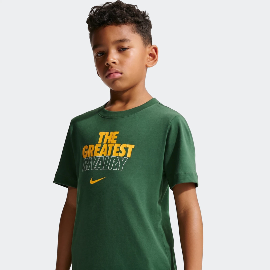 Young boy wearing a dark green Nike Springboks Rugby's Greatest Rivalry Tour kids t-shirt with a yellow graphic print.