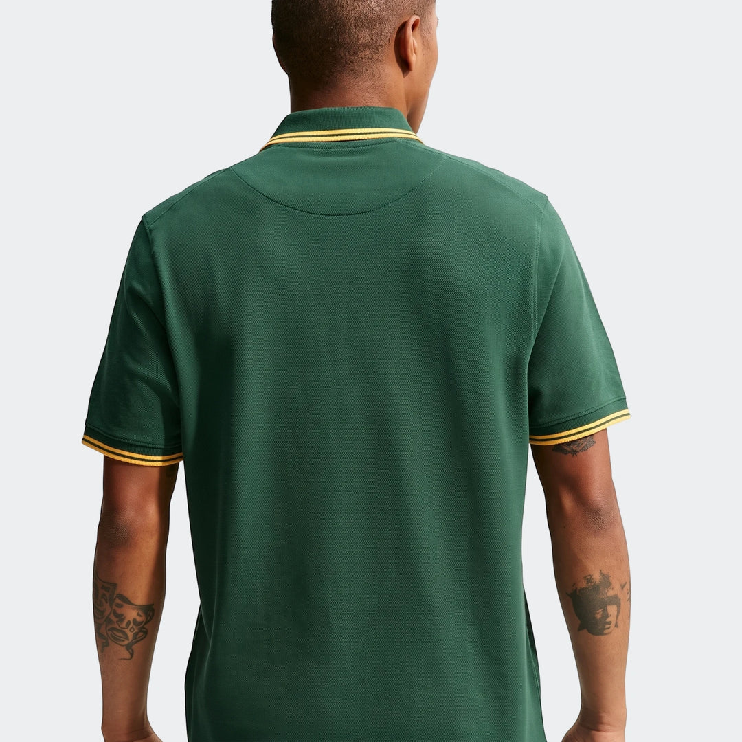 Rear view of a men's Nike Springboks Pique Polo Golfer in green with gold striped collar and sleeve cuffs.
