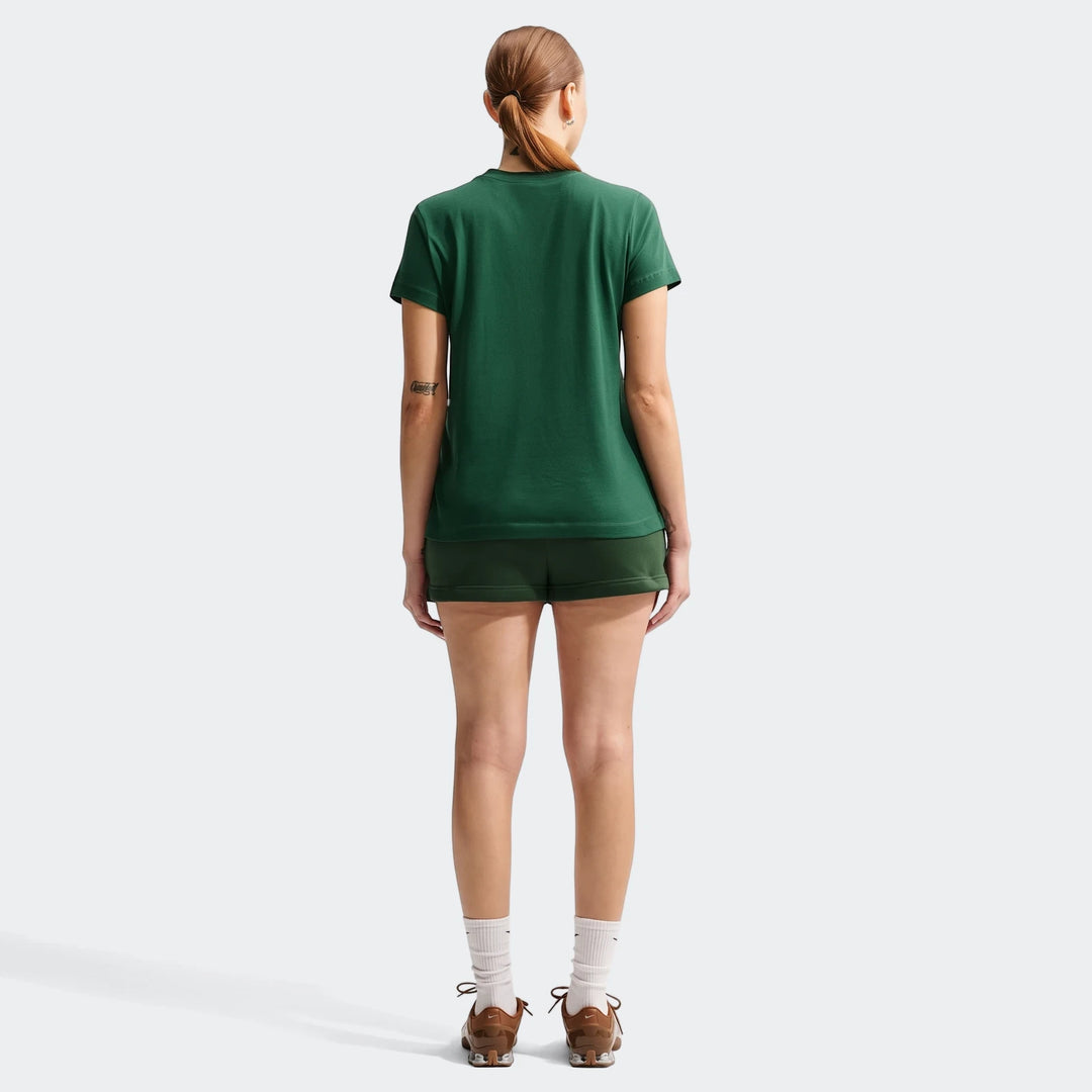 Woman wearing a 2026 Nike Springboks Rugby’S Greatest Rivalry Tour Women T-Shirt in green and dark green shorts, viewed from