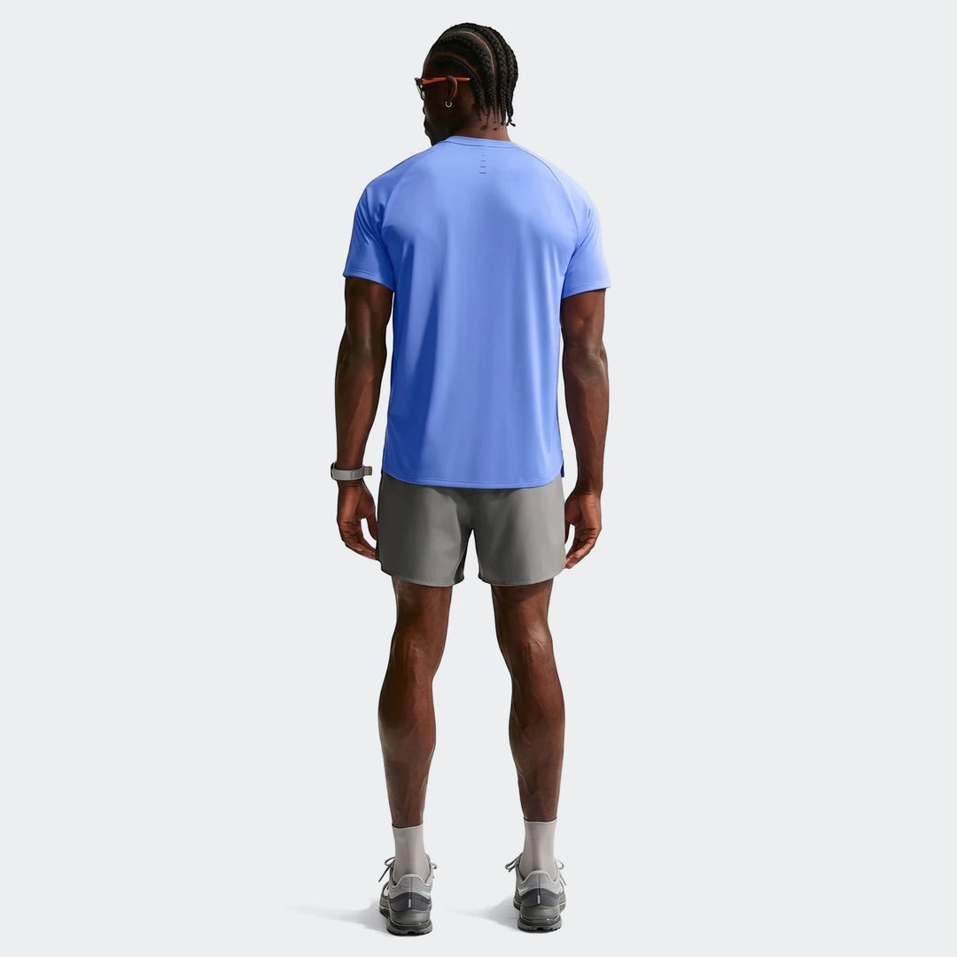 Nike Stride Blue Men's Dri-Fit ADV Short-Sleeve Running Top worn by a man, shown from the back.