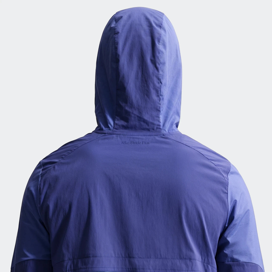 Nike Stride Plus Blue Men's Repel Running Jacket, shown from the back with the hood up, worn by a person.