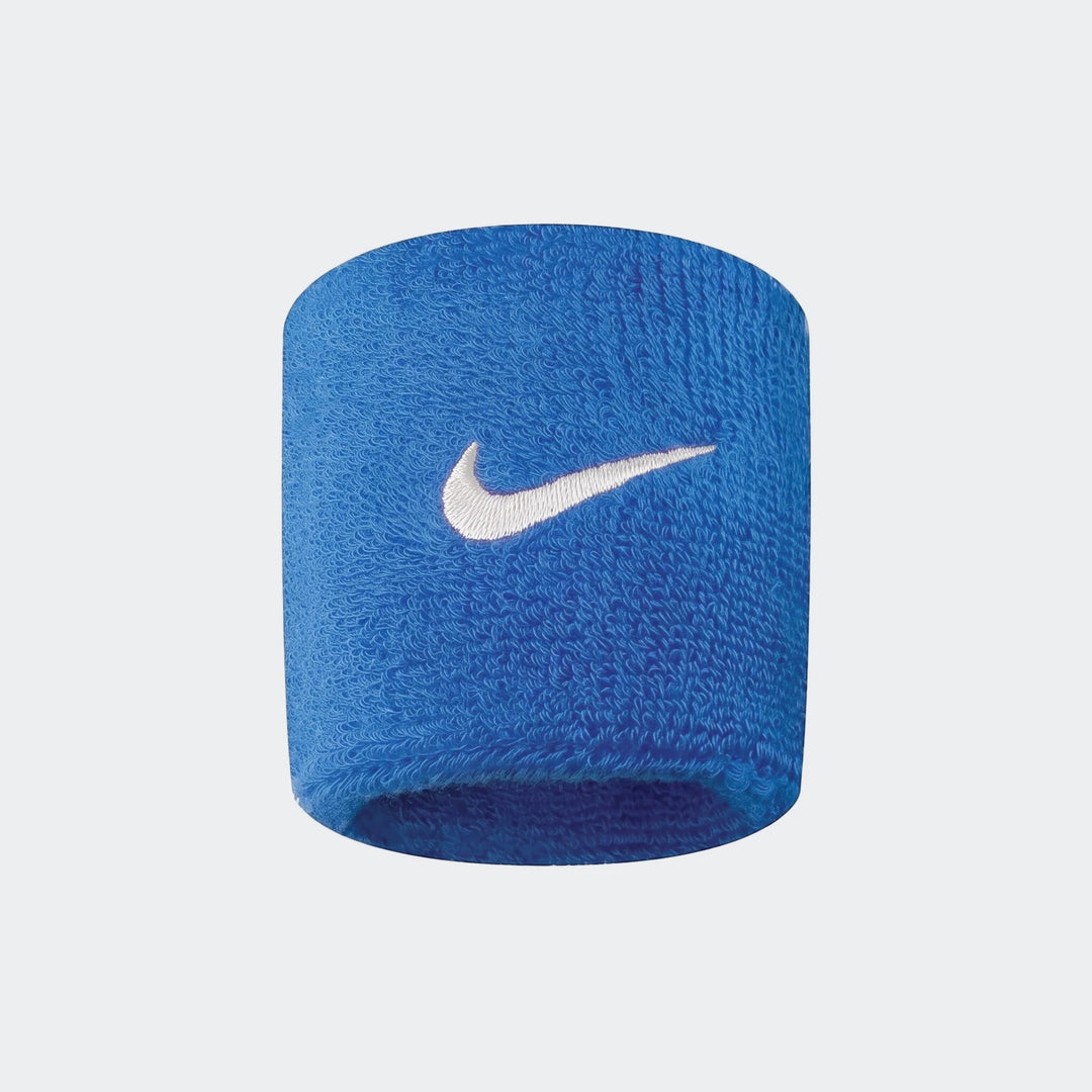 Blue Nike Swoosh Classic wristband made of terrycloth fabric, prominently displaying the white logo.