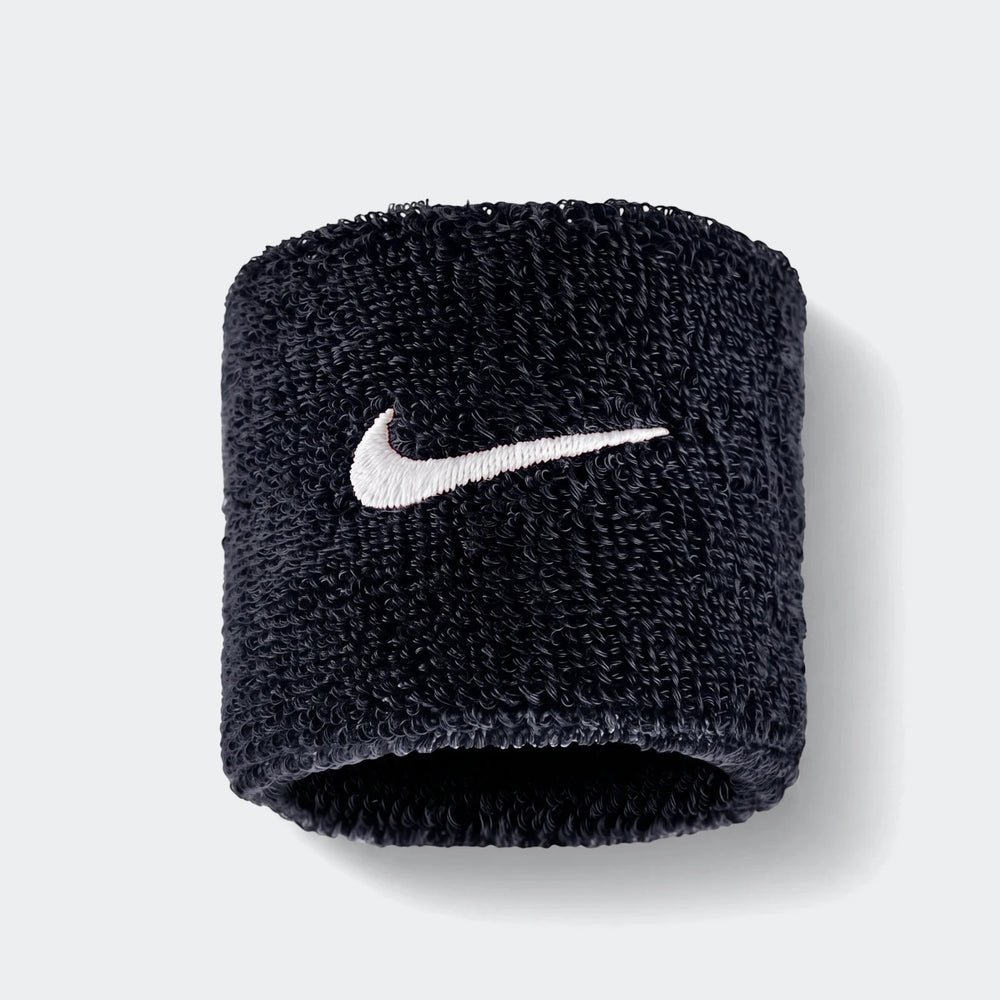 A single black Nike Swoosh Classic D terry cloth wristband, featuring a white embroidered Swoosh logo, displayed vertically