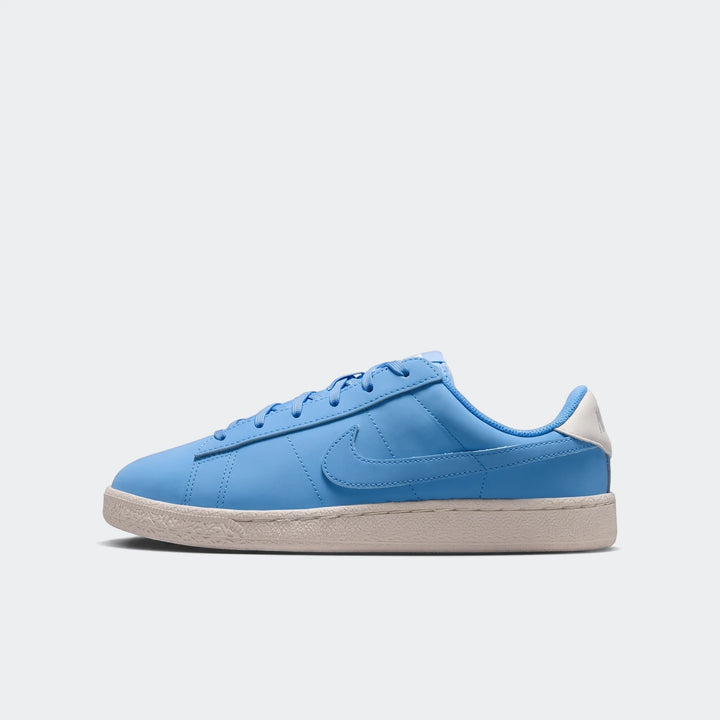 Nike Tennis Classic Big Kids' Shoes in light blue with an off-white sole, shown in a side view.