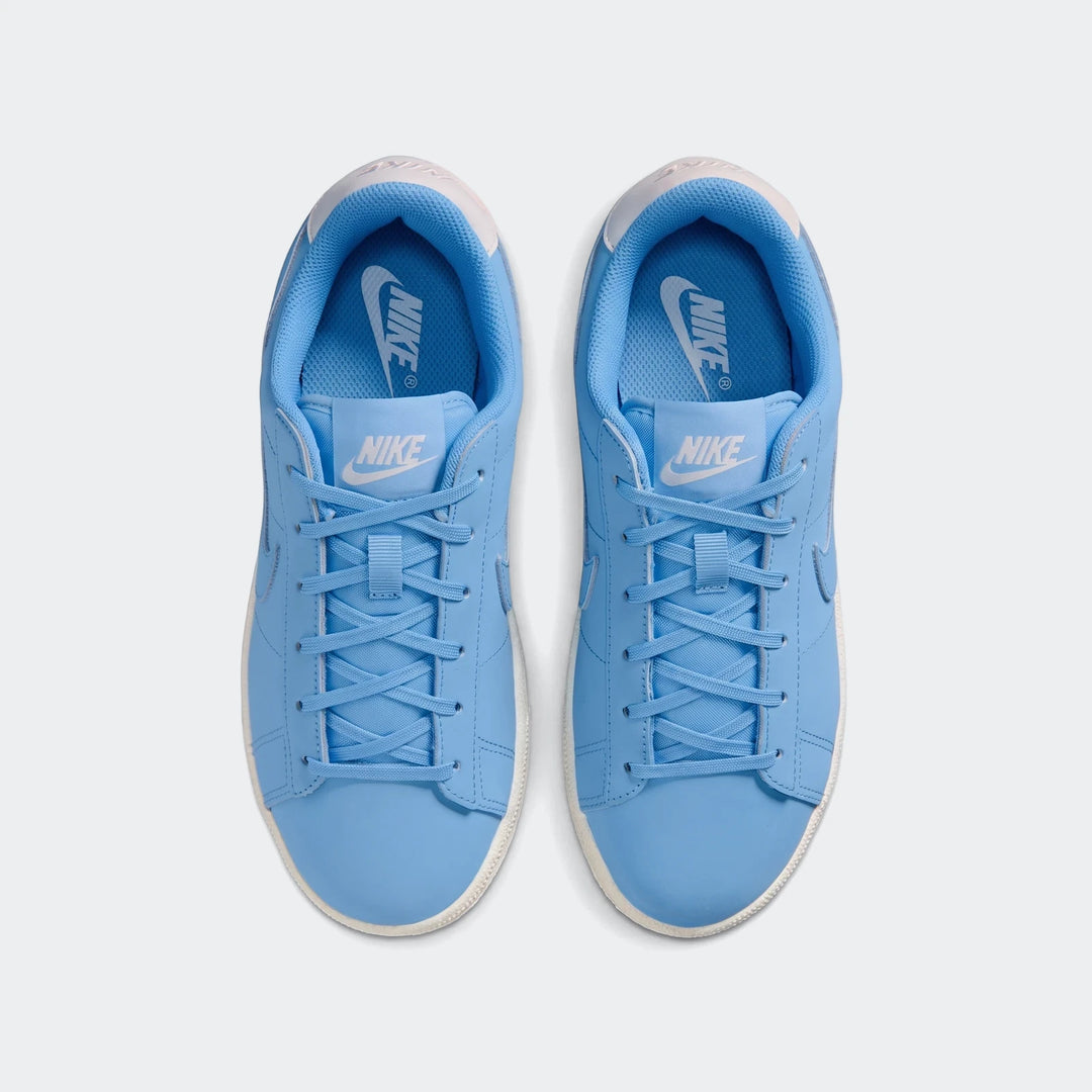 Pair of light blue Nike Tennis Classic Big Kids' shoes with white soles and laces, photographed from a top-down view.