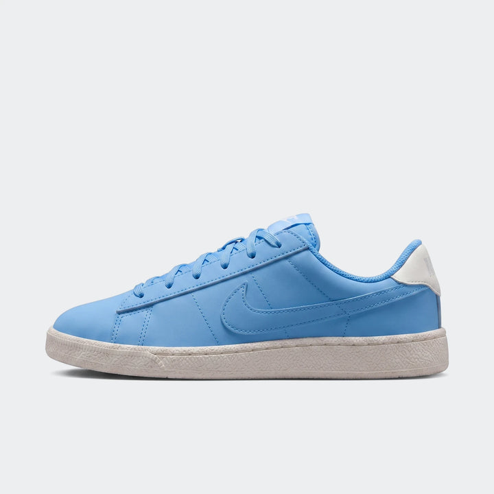 Nike Tennis Classic Big Kids' Shoes in sky blue, presented in a side view on a white background, featuring a classic low-top
