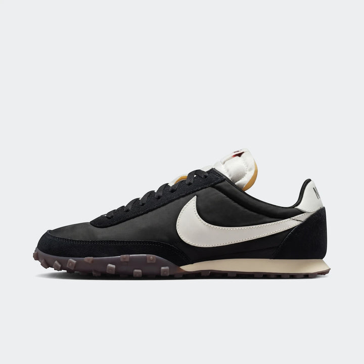 Nike Waffle Racer men's shoes in black and grey, featuring a white swoosh and waffle outsole, viewed from the side.