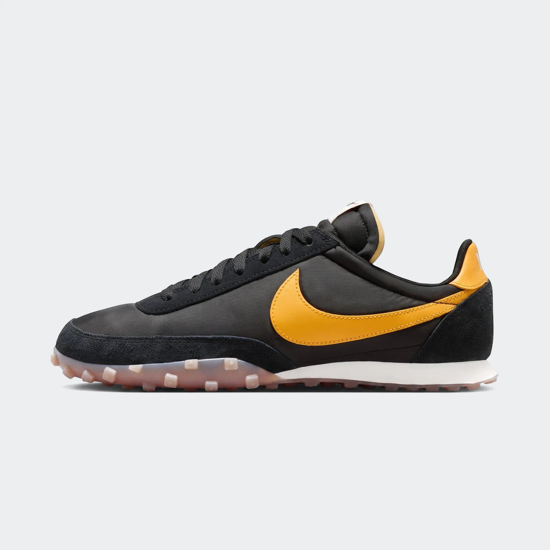 Nike Waffle Racer Men's Shoes in black with a yellow Swoosh, featuring a classic low-profile design and waffle outsole, side