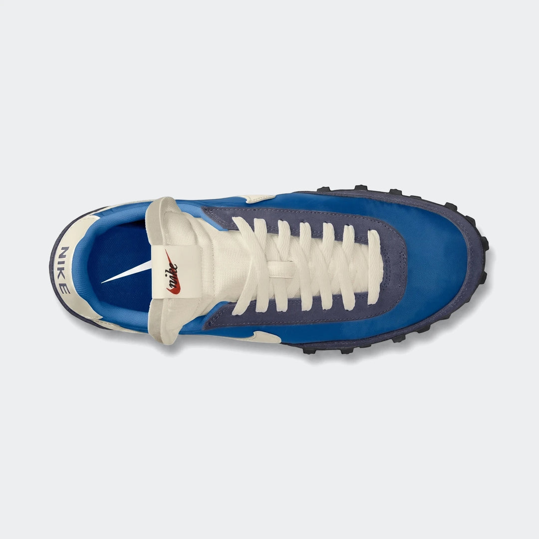 Top-down view of Nike Waffle Racer Men'S Shoes in blue and off-white, featuring a classic sneaker design.