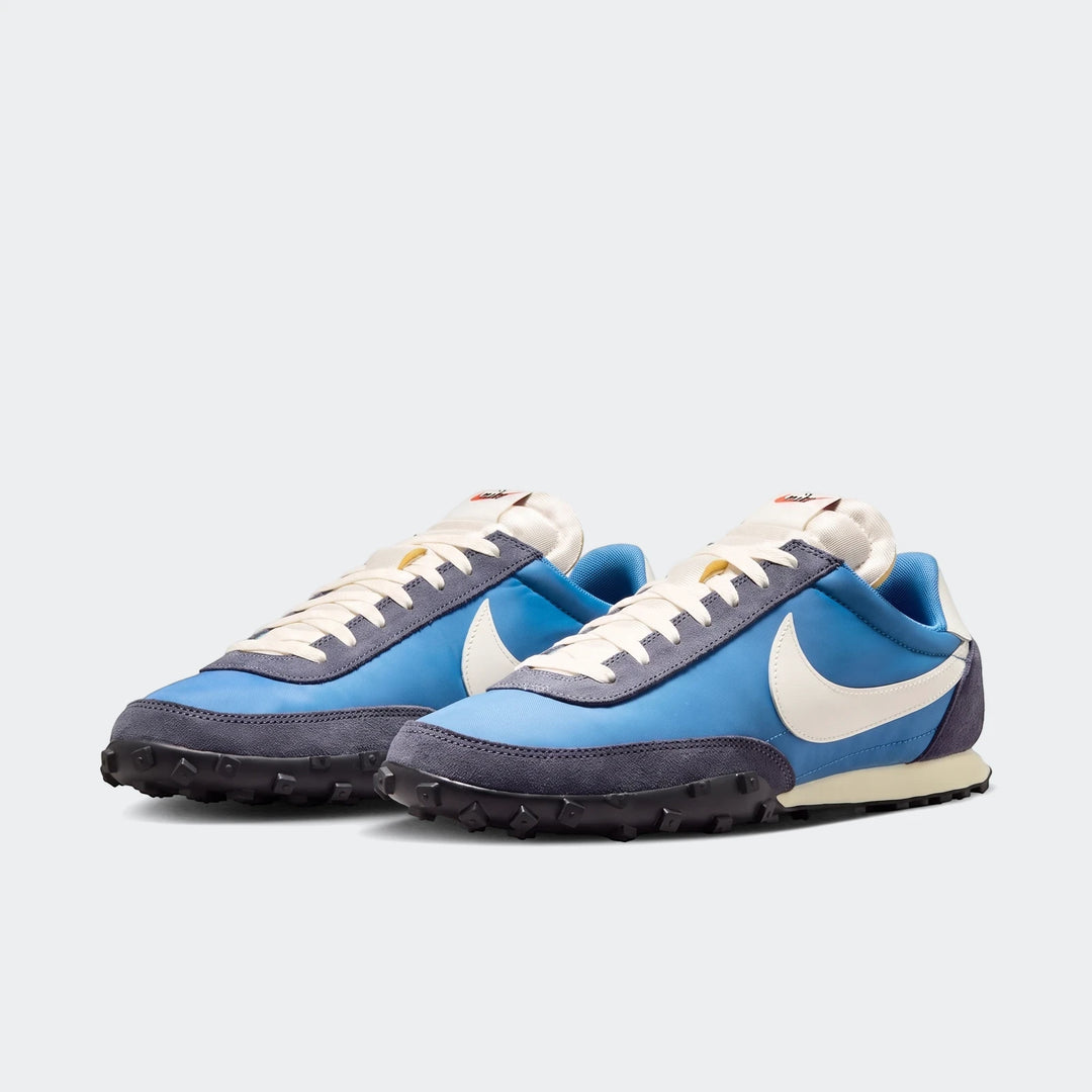 A pair of blue and white Nike Waffle Racer men's shoes with a distinctive waffle sole, presented on a clean background.