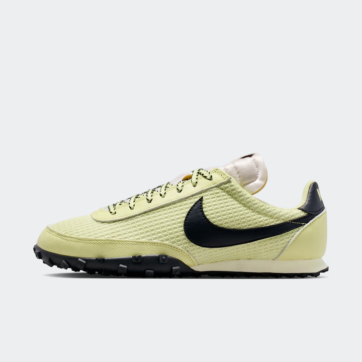 Light green Nike Waffle Racer SE men's shoes with a black swoosh and waffle outsole, presented in a side profile.
