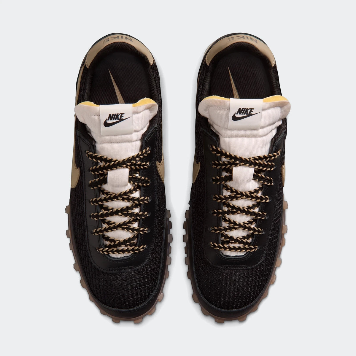 Black and beige Nike Waffle Racer Se men's shoes, designed with a mesh upper and waffle outsole, shown from a top-down