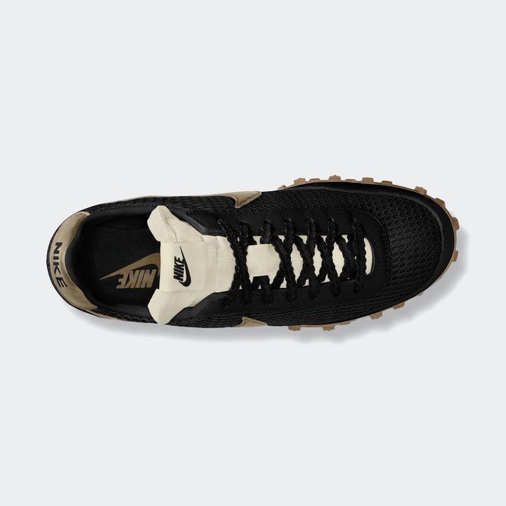 Nike Waffle Racer Se Men's Shoes featuring a black mesh upper, cream accents, and a brown gum sole, viewed from the top-down.