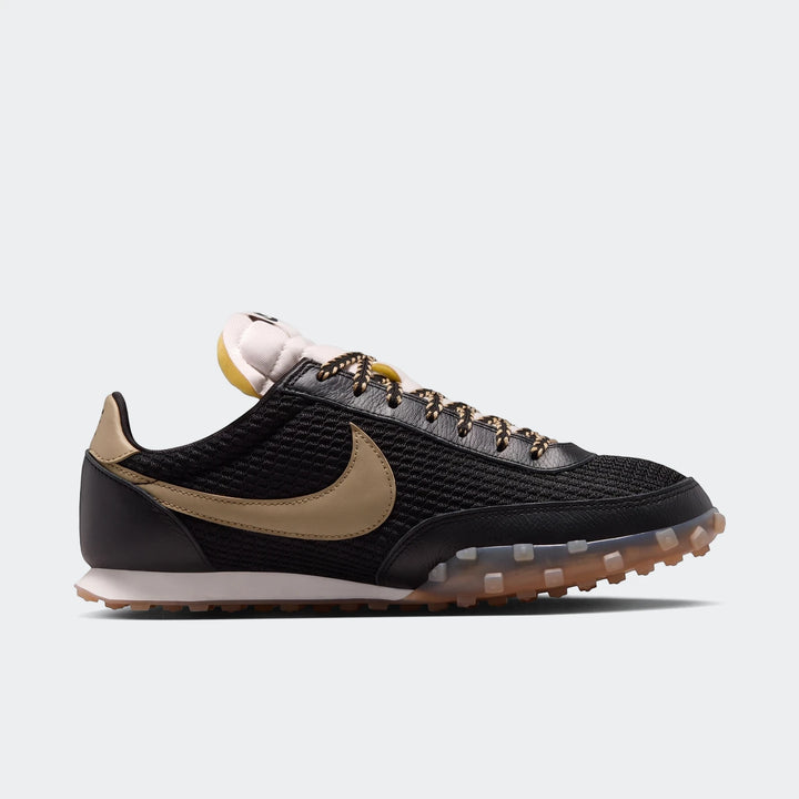 Nike Waffle Racer Se men's shoes in black with tan accents, featuring a mesh upper and studded sole, presented in a side