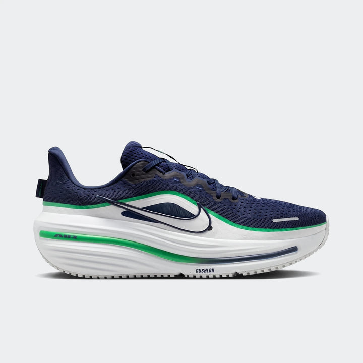 Nike Winflo 12 men's road running shoe in navy blue and white with green accents, showcased in a side profile view.