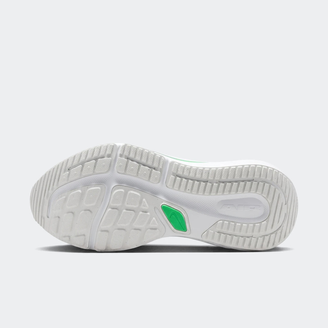 Bottom view of a Nike Winflo 12 men's road running shoe, featuring a textured white and grey sole with green accents and