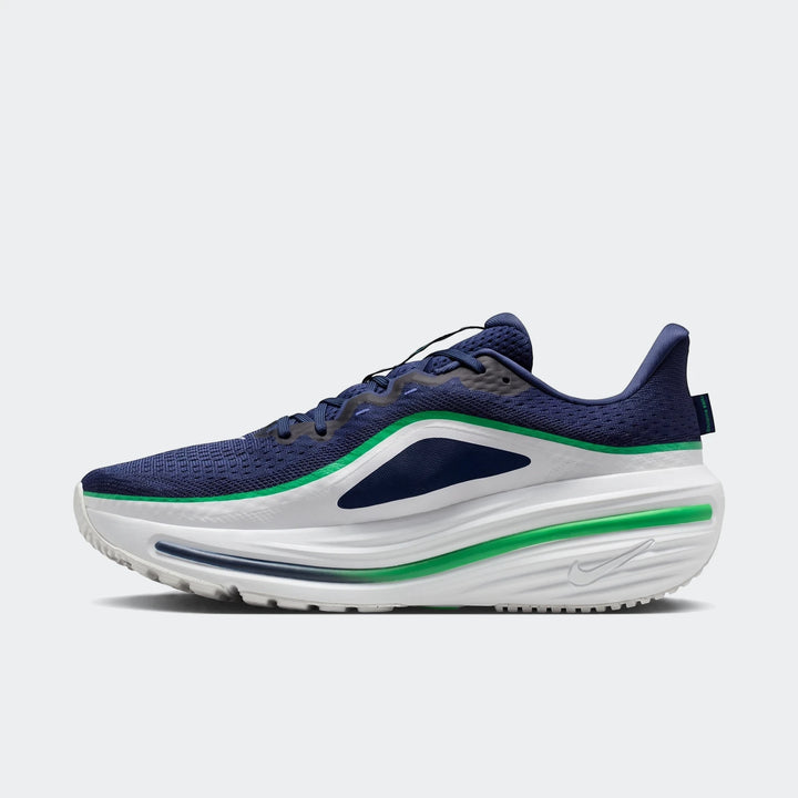 Nike Winflo 12 Men's Road Running Shoes in navy blue, white, and green, captured in a dynamic profile view.