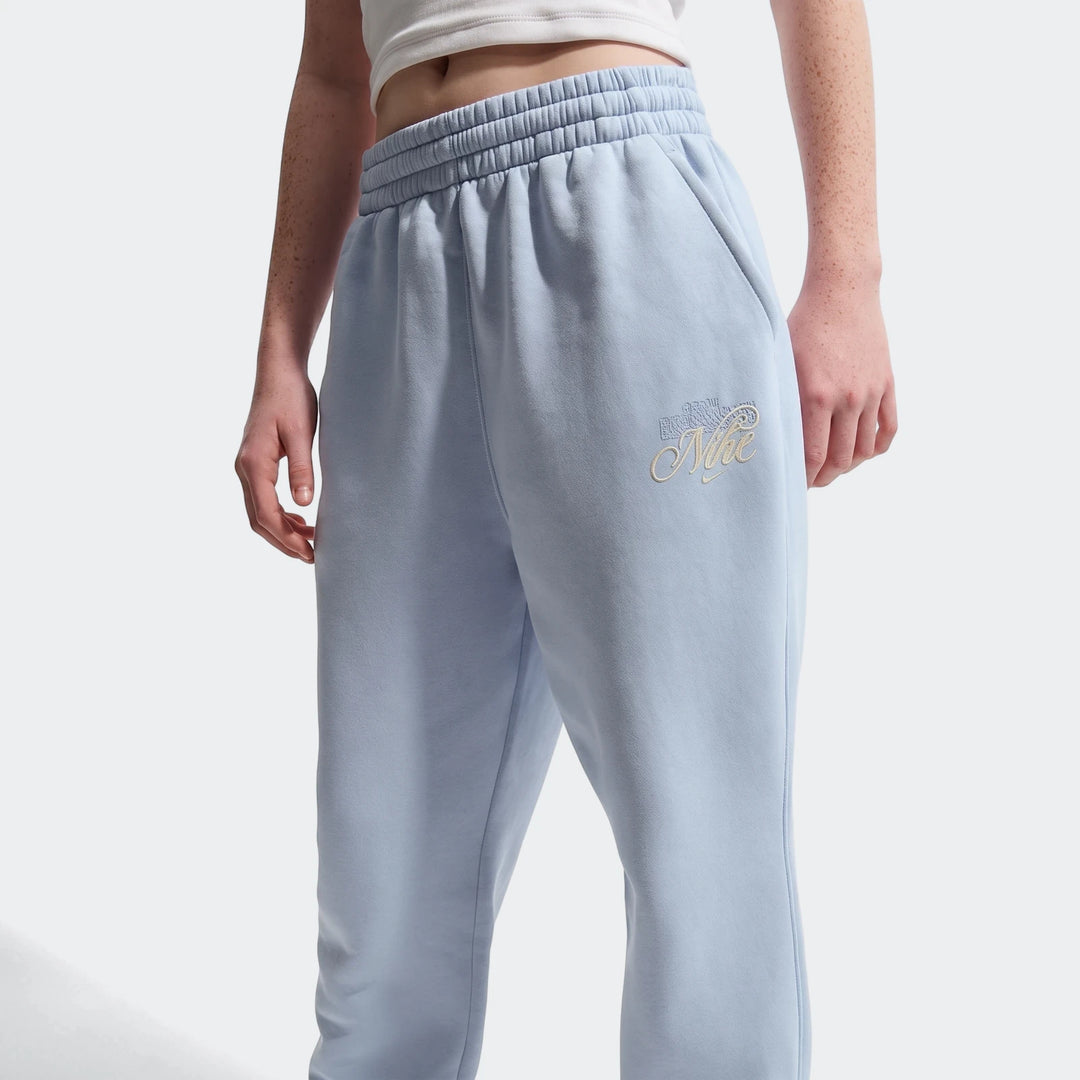 Light blue Nike fleece sweatpants for women, featuring a comfortable relaxed fit and an embroidered gold logo.