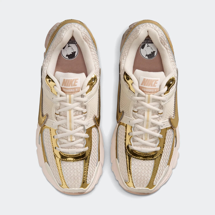Pair of Nike Zoom Vomero 5 Women's Shoes in cream with metallic gold accents, shown from a top-down perspective.